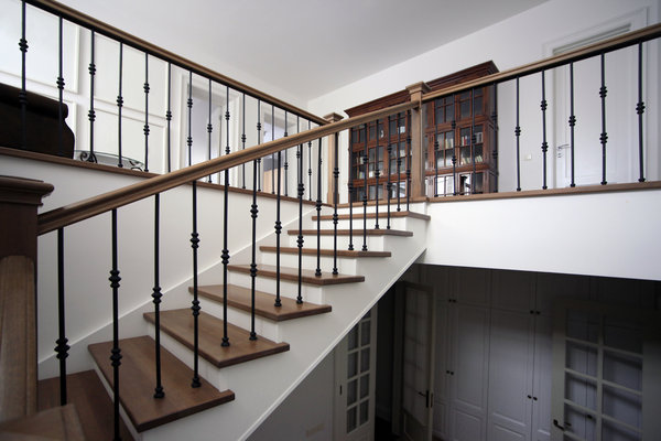 Wooden staircase renovation leading to a basement suite. This home renovation was done in Burnaby.