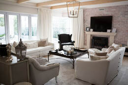 Modern living room renovations with brick wall installation. This was a home renovation done in Burnaby.